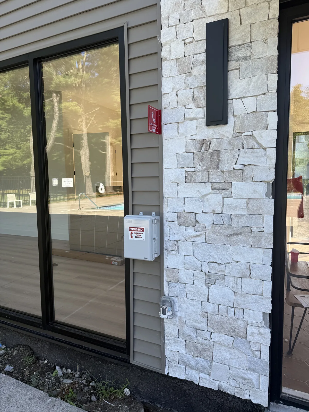 Outdoor intercom on a stone pier
