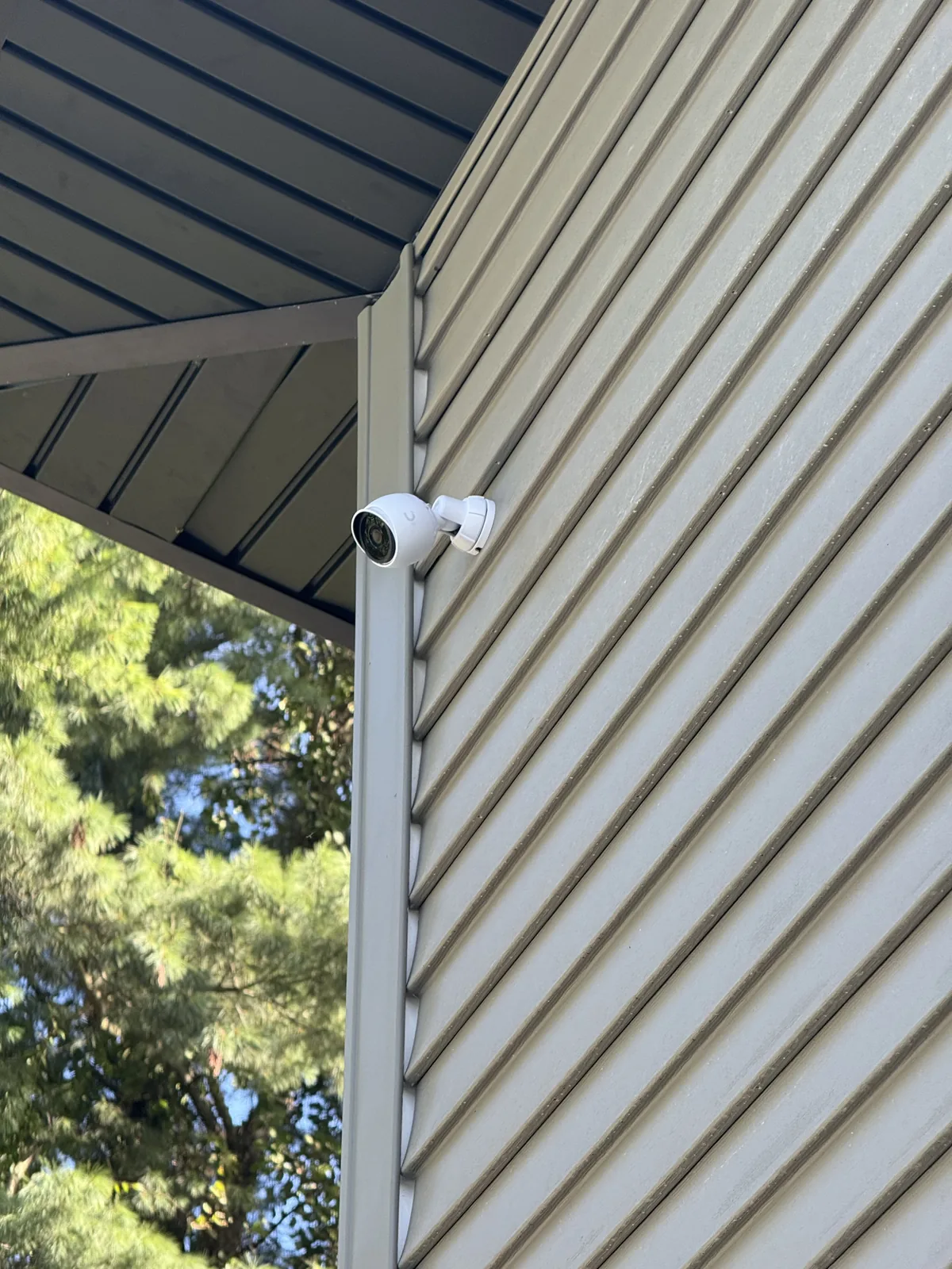 Security camera mounted on siding