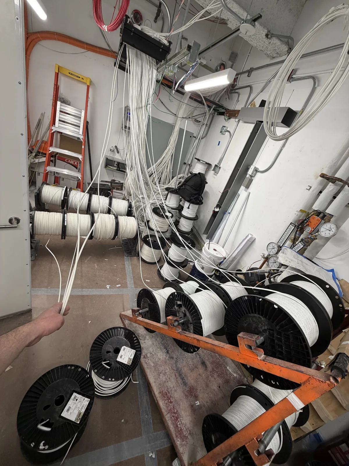 Fiber and cable spools on a job site